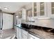 Kitchen with white shaker cabinets, granite countertops and stainless steel appliances at 4266 W Pondview Dr, Littleton, CO 80123