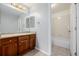 Bright bathroom featuring a single sink vanity and tiled shower/bath at 9461 Elmhurst Ln # C, Highlands Ranch, CO 80129
