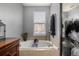 Relaxing bathroom featuring a soaking tub and grey decor at 9461 Elmhurst Ln # C, Highlands Ranch, CO 80129