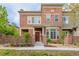 Beautiful two-story brick home featuring manicured landscaping and a gated entrance at 9461 Elmhurst Ln # C, Highlands Ranch, CO 80129