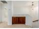 Upstairs hallway area featuring a built in cabinet, neutral walls, carpet, and hanging light fixture at 9461 Elmhurst Ln # C, Highlands Ranch, CO 80129