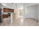 Spacious kitchen with tile floors, wooden cabinets, and modern stainless steel appliances at 9461 Elmhurst Ln # C, Highlands Ranch, CO 80129