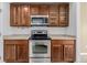 Kitchen features wooden cabinets, stainless steel oven, and a built-in microwave at 9461 Elmhurst Ln # C, Highlands Ranch, CO 80129