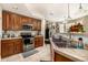 Beautiful kitchen featuring stainless steel appliances and tile countertops at 9461 Elmhurst Ln # C, Highlands Ranch, CO 80129