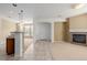 Spacious living area with tile floors, adjoining carpeted space, and an inviting atmosphere at 9461 Elmhurst Ln # C, Highlands Ranch, CO 80129