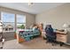 Comfortable bedroom with a desk area, perfect for studying or gaming with a view of the outdoors at 8182 Grady Cir, Castle Rock, CO 80108