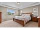 Bright, spacious primary bedroom with a tray ceiling, plush carpet, and natural light at 8182 Grady Cir, Castle Rock, CO 80108