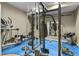 Home gym with workout equipment and blue flooring at 8182 Grady Cir, Castle Rock, CO 80108