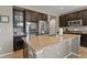 Well-equipped kitchen featuring dark cabinets, stainless steel appliances, and granite countertops on the island at 8182 Grady Cir, Castle Rock, CO 80108