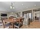 Open-concept kitchen with a center island, stainless appliances, and adjoined dining area with stone fireplace at 8182 Grady Cir, Castle Rock, CO 80108