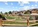 Charming neighborhood street view with homes, fences, and garden beds at 8182 Grady Cir, Castle Rock, CO 80108