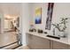 Bar area features natural light, a sink, quartz counters and sleek modern cabinetry at 3632 N Pecos St, Denver, CO 80211