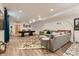 Spacious finished basement with media area, sofa, billiard table and wood-look floors at 3632 N Pecos St, Denver, CO 80211