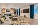 Finished basement with large sofa, media area, and modern decor creates an inviting living space at 3632 N Pecos St, Denver, CO 80211