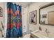 Bathroom featuring a tub, shower, patterned curtain, white tile, and modern fixtures at 3632 N Pecos St, Denver, CO 80211