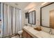 Contemporary bathroom with double vanity, modern mirrors, and stylish shower curtain at 3632 N Pecos St, Denver, CO 80211
