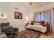 Cozy bedroom with unique lighting fixture, eclectic décor, and comfortable seating area at 3632 N Pecos St, Denver, CO 80211