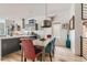 Modern dining area with stylish light fixture and an open view of the kitchen at 3632 N Pecos St, Denver, CO 80211