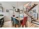 Modern dining area with a staircase and plenty of natural light at 3632 N Pecos St, Denver, CO 80211