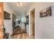 Bright entryway with wood floors and modern decor leading to a view of the living area at 3632 N Pecos St, Denver, CO 80211