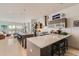 Modern kitchen with stainless steel appliances, an island, and breakfast bar seating; great for entertaining! at 3632 N Pecos St, Denver, CO 80211