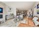 Open-concept living space with modern decor, fireplace, and seamless flow to kitchen at 3632 N Pecos St, Denver, CO 80211