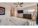 Light-filled main bedroom with modern ceiling fan, large dresser, and an abundance of natural light at 3632 N Pecos St, Denver, CO 80211