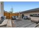 Outdoor patio seating area, privacy fence, and stylish patio furniture provide a great entertainment space at 3632 N Pecos St, Denver, CO 80211