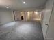 Spacious basement area with plush carpeting and neutral tones ready for customization at 7925 W Layton Ave # 322, Littleton, CO 80123