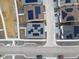 Aerial shot of rooftops fitted with solar panels, complementing a well-planned neighborhood and a sustainable energy choice at 928 Farrier Ln, Lafayette, CO 80026