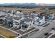 Aerial view of the neighborhood showcasing mountain backdrop, contemporary architecture, and community layout at 928 Farrier Ln, Lafayette, CO 80026