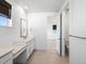Bright bathroom featuring double vanity, quartz countertops, and a separate toilet room at 928 Farrier Ln, Lafayette, CO 80026