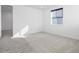 Bright, airy bedroom featuring a modern window and fresh carpet flooring, creating a serene and comfortable space at 928 Farrier Ln, Lafayette, CO 80026