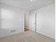 A bright, carpeted bedroom featuring a walk-in closet with white trim, offering a serene and functional space at 928 Farrier Ln, Lafayette, CO 80026