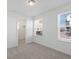 Bright bedroom featuring two large windows with modern blinds, offering natural light and neighborhood views at 928 Farrier Ln, Lafayette, CO 80026