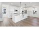 Bright kitchen with an island, stainless steel appliances, and white cabinetry at 928 Farrier Ln, Lafayette, CO 80026