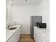 Kitchenette with quartz countertop and stainless steel appliances at 928 Farrier Ln, Lafayette, CO 80026