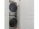 Laundry room with a stackable washer and dryer at 928 Farrier Ln, Lafayette, CO 80026