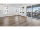 Open living room with lots of natural light from windows and sliding glass doors at 928 Farrier Ln, Lafayette, CO 80026