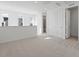A light-filled loft featuring three windows and modern lighting, offering a versatile and inviting space at 928 Farrier Ln, Lafayette, CO 80026