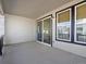 Covered patio featuring sliding glass doors and windows, providing a seamless transition from indoor to outdoor living at 928 Farrier Ln, Lafayette, CO 80026