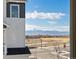 Scenic view showcasing snow-capped mountains, clear blue sky, and charming neighborhood homes from inside property at 928 Farrier Ln, Lafayette, CO 80026