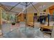 Inviting back patio with an umbrella-covered table, a grill, and cozy outdoor seating at 1353 Elk Valley Dr, Evergreen, CO 80439