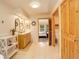 Bright bathroom featuring double vanities, and an open doorway to the bedroom and toilet room at 1353 Elk Valley Dr, Evergreen, CO 80439