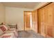 Spare bedroom with carpeted floors, closet, doorway to hall, and twin daybed at 1353 Elk Valley Dr, Evergreen, CO 80439