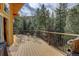 Relaxing outdoor deck with seating, ideal for enjoying nature and outdoor meals at 1353 Elk Valley Dr, Evergreen, CO 80439