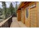Stunning wood cabin with large deck. Perfect for enjoying the scenic view at 1353 Elk Valley Dr, Evergreen, CO 80439