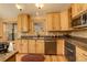 Charming kitchen with granite countertops, modern appliances, and ample natural light from a large window at 1353 Elk Valley Dr, Evergreen, CO 80439