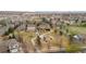 Aerial view showcases a community park with a playground, walking path, and green space surrounded by homes at 11402 Benton Ct, Westminster, CO 80020