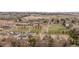 An aerial shot shows a neighborhood with nearby commercial areas, green spaces, and community amenities at 11402 Benton Ct, Westminster, CO 80020